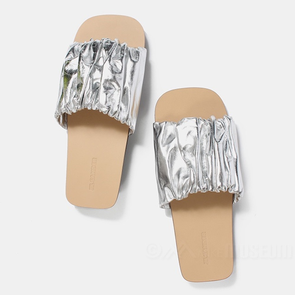 Jill Sander Silver leather slides .